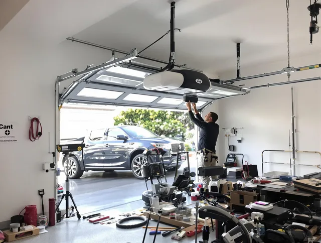 Groton Garage Door Repair specialist installing smart garage door opener system in Groton home