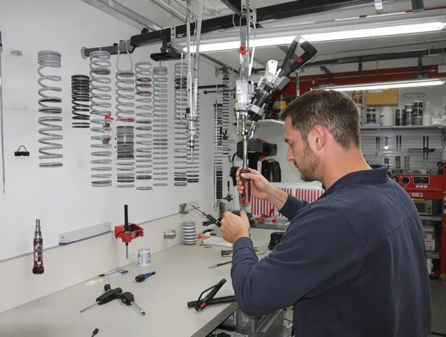 Groton Garage Door Repair safety certified technician performing precision spring replacement in Groton